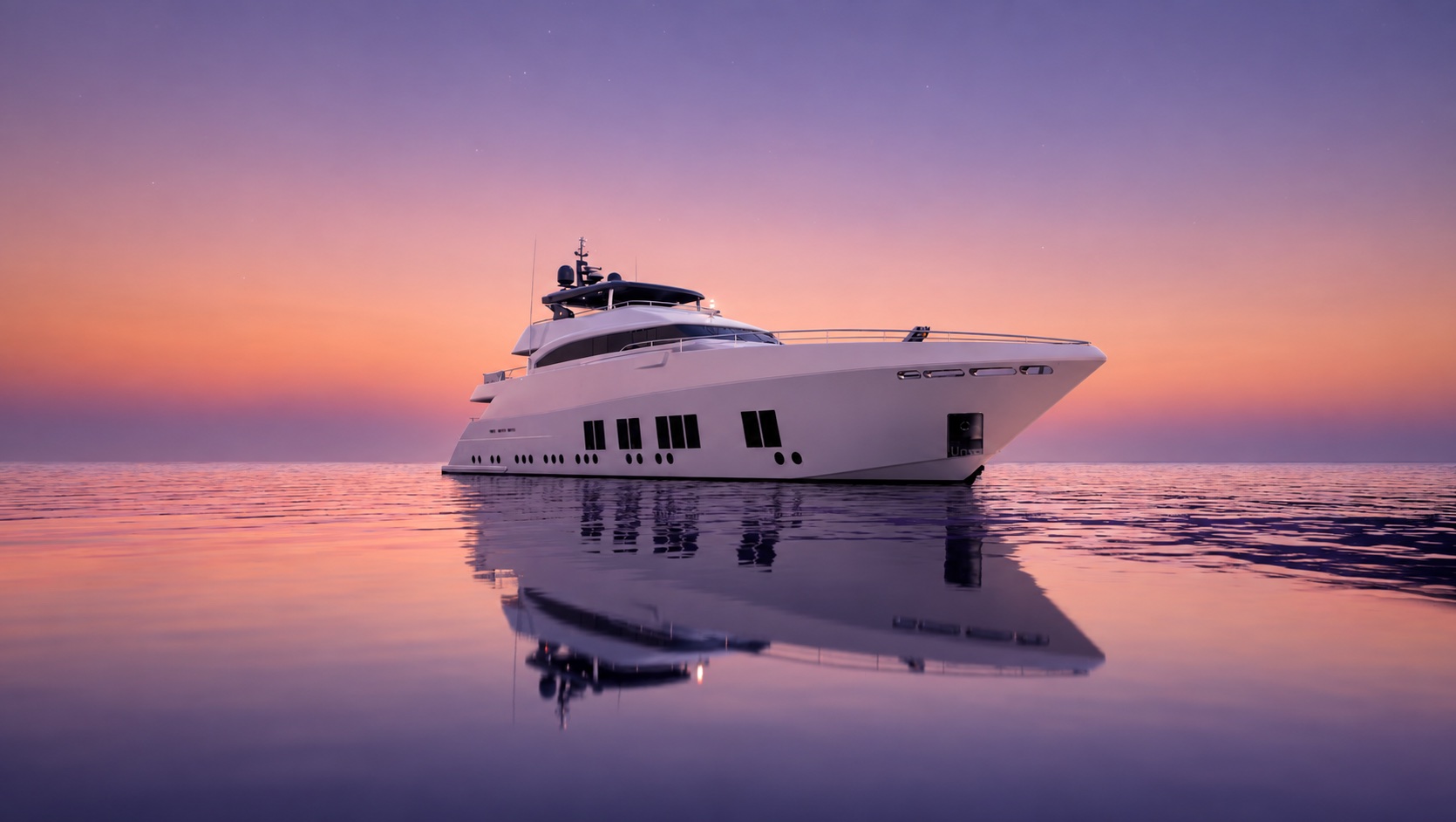 A superyacht at anchor at golden hour, calm water to the right